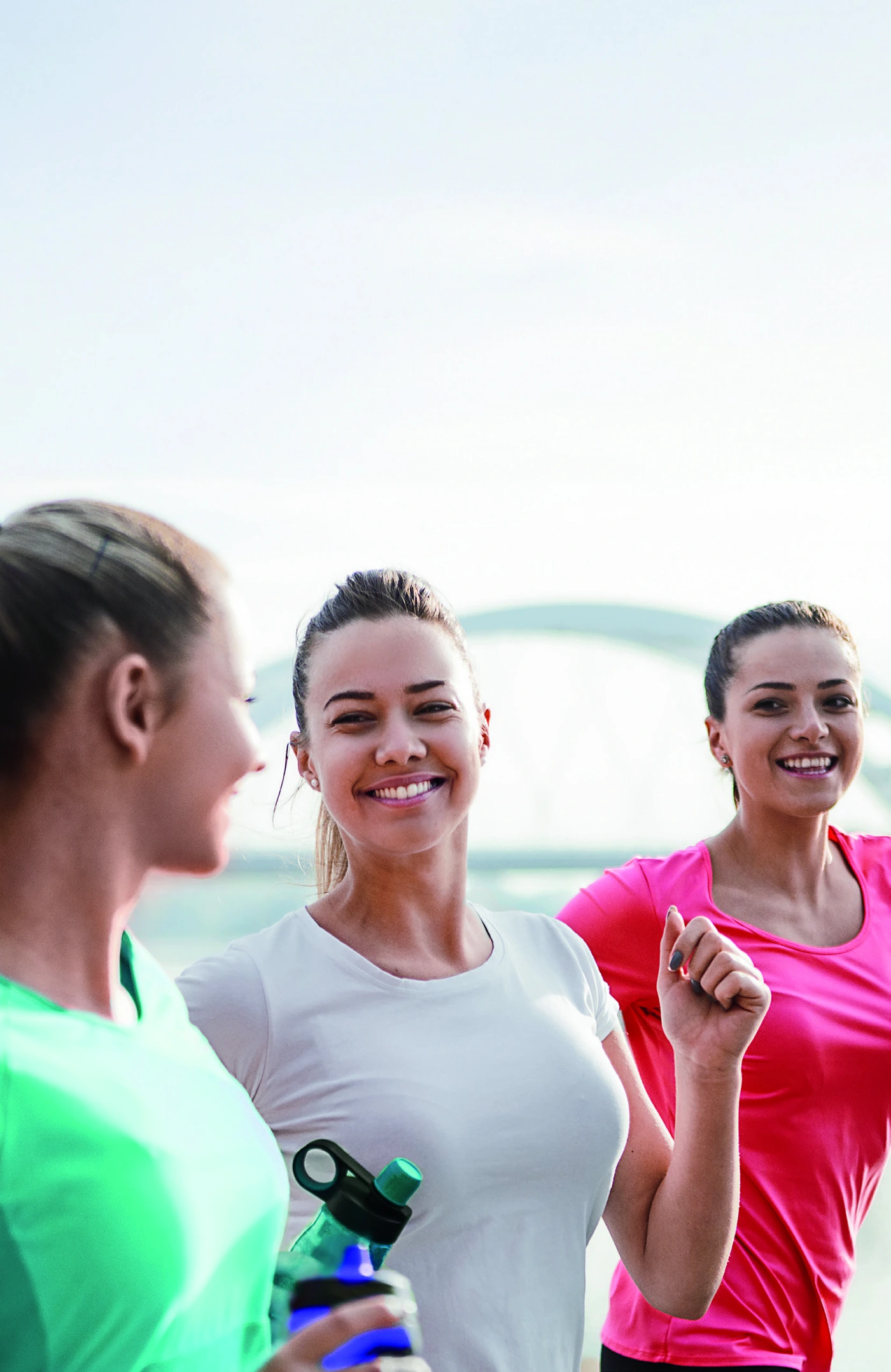 Young adults sharing smiles after exercise, from the ClearCorrect patient brochure.
